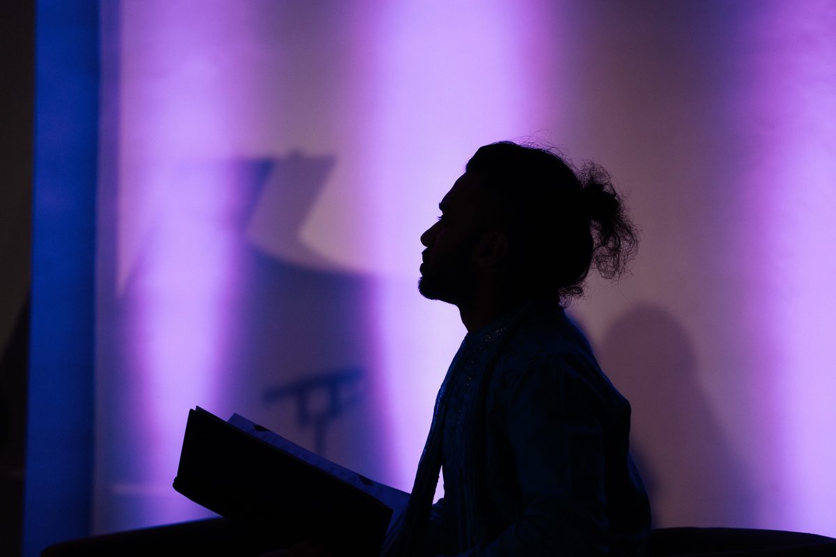 Silhouette of Oscar Castellino singing at the Leeds Lieder Festival